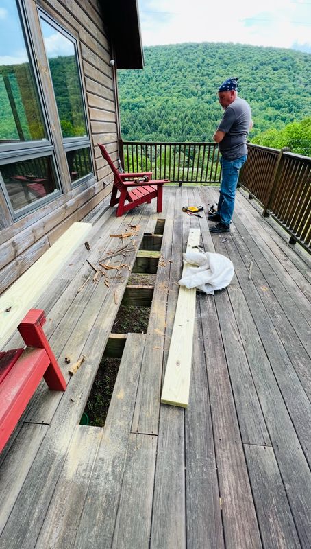 Cutting out rotted deck boards and replacing them