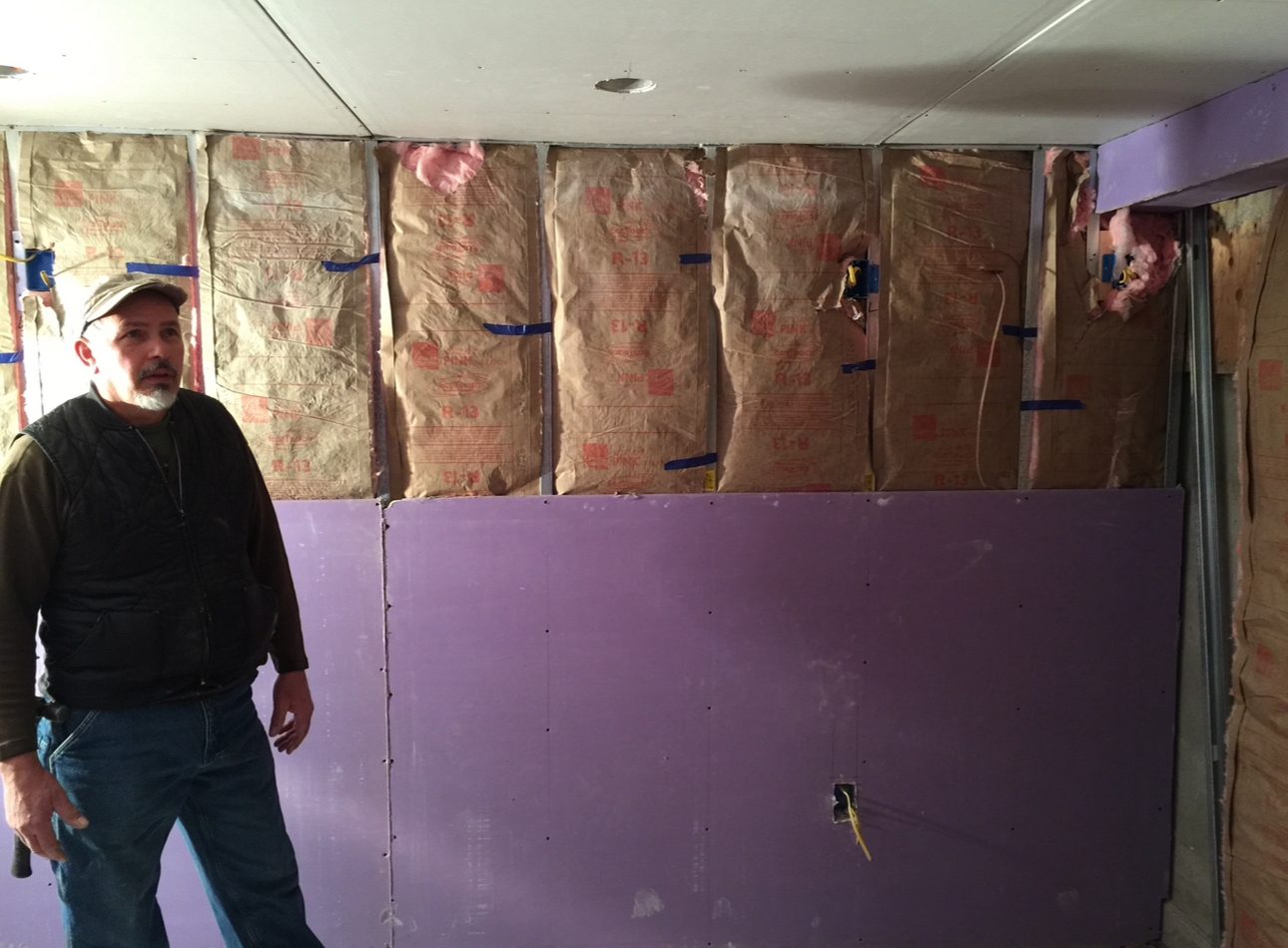 Opening up a wall — insulation and board going back in
